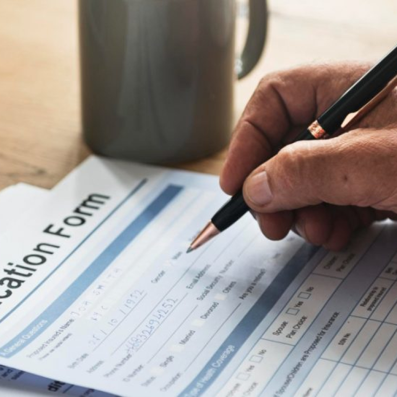 pensioner-filling-out-aform-900x550